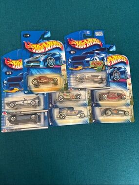 8 hot wheels cars including 5 tat rods